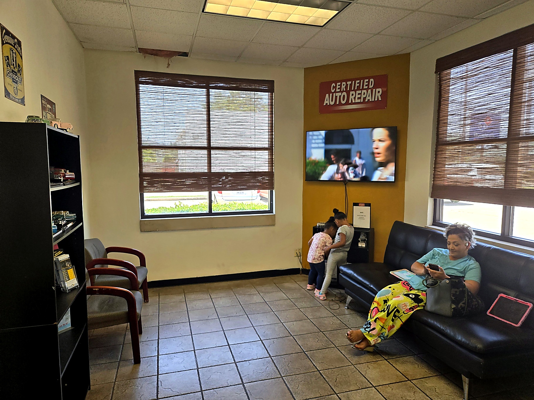 Customer waiting area with TV at Auto Care USA Briar Forest in Houston, TX