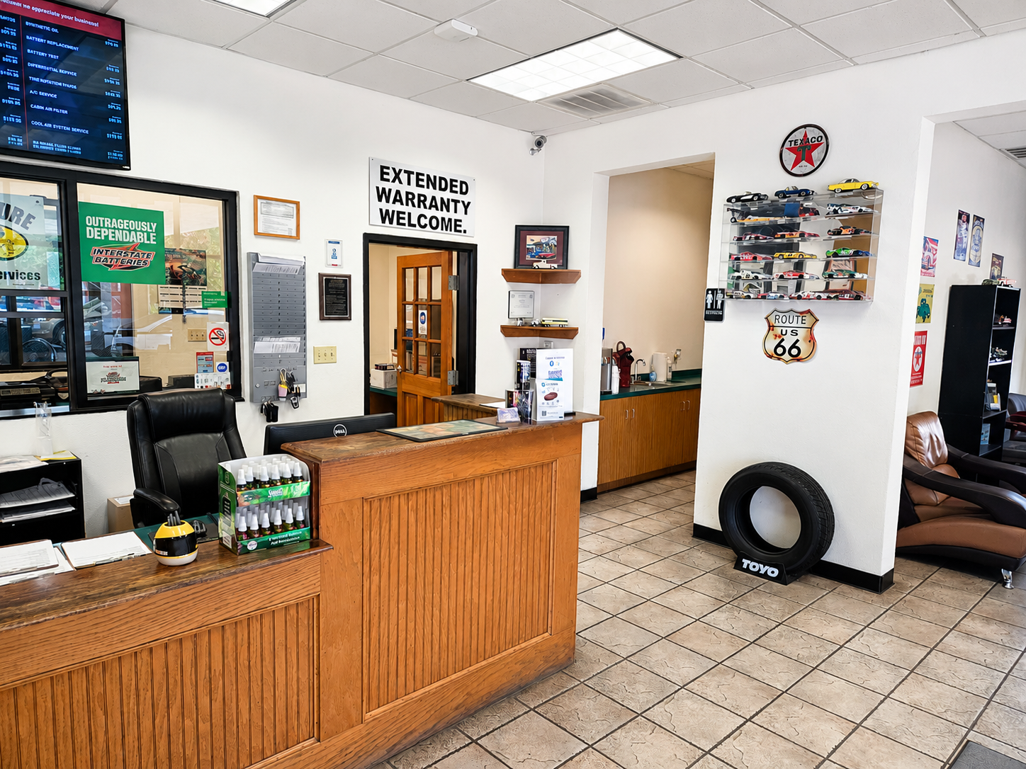 Waiting room with Route 66 and classic car decor at Auto Care USA Briar Forest