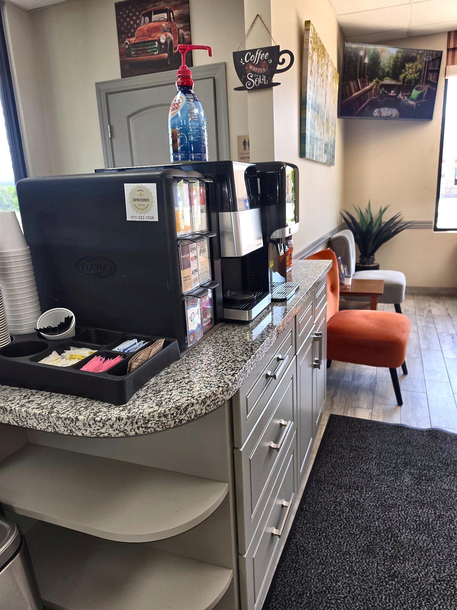 Complimentary coffee station at Auto Care USA in Katy, TX