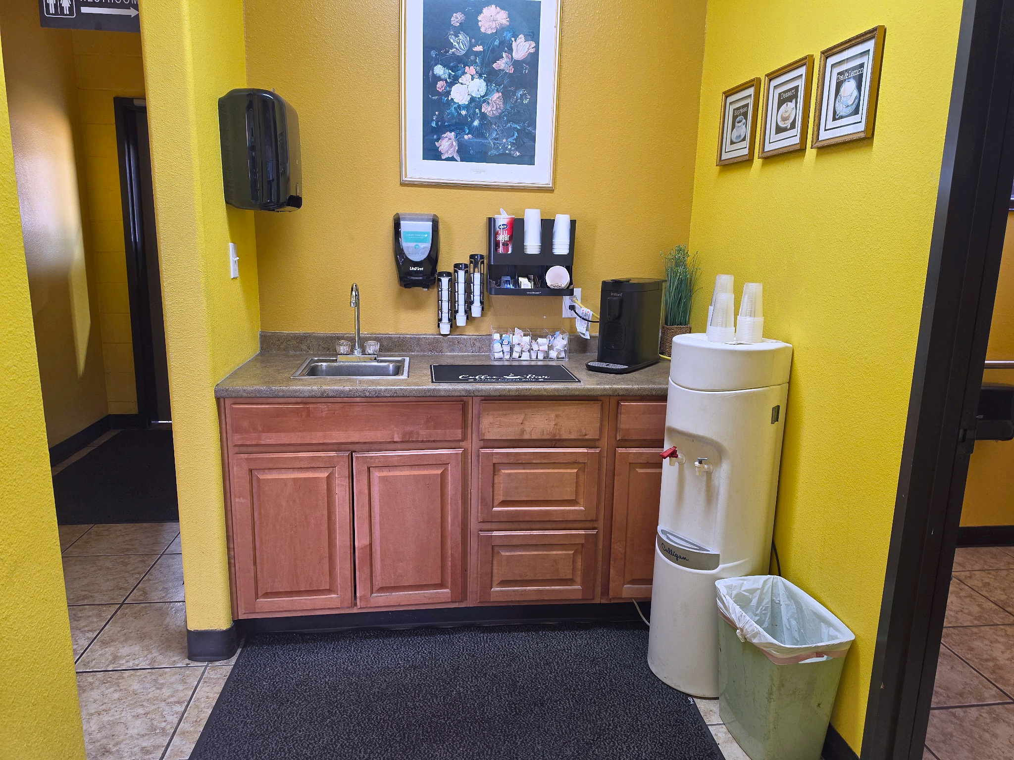 Complimentary coffee and water station at Auto Care USA in Rosenberg, TX