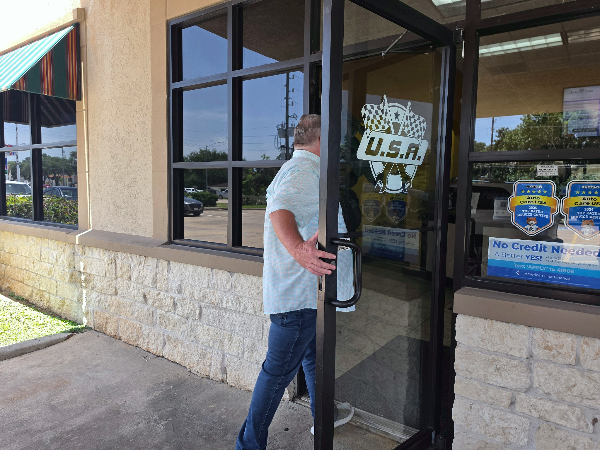 Customer entering the front office at Auto Care USA in Rosenberg, TX