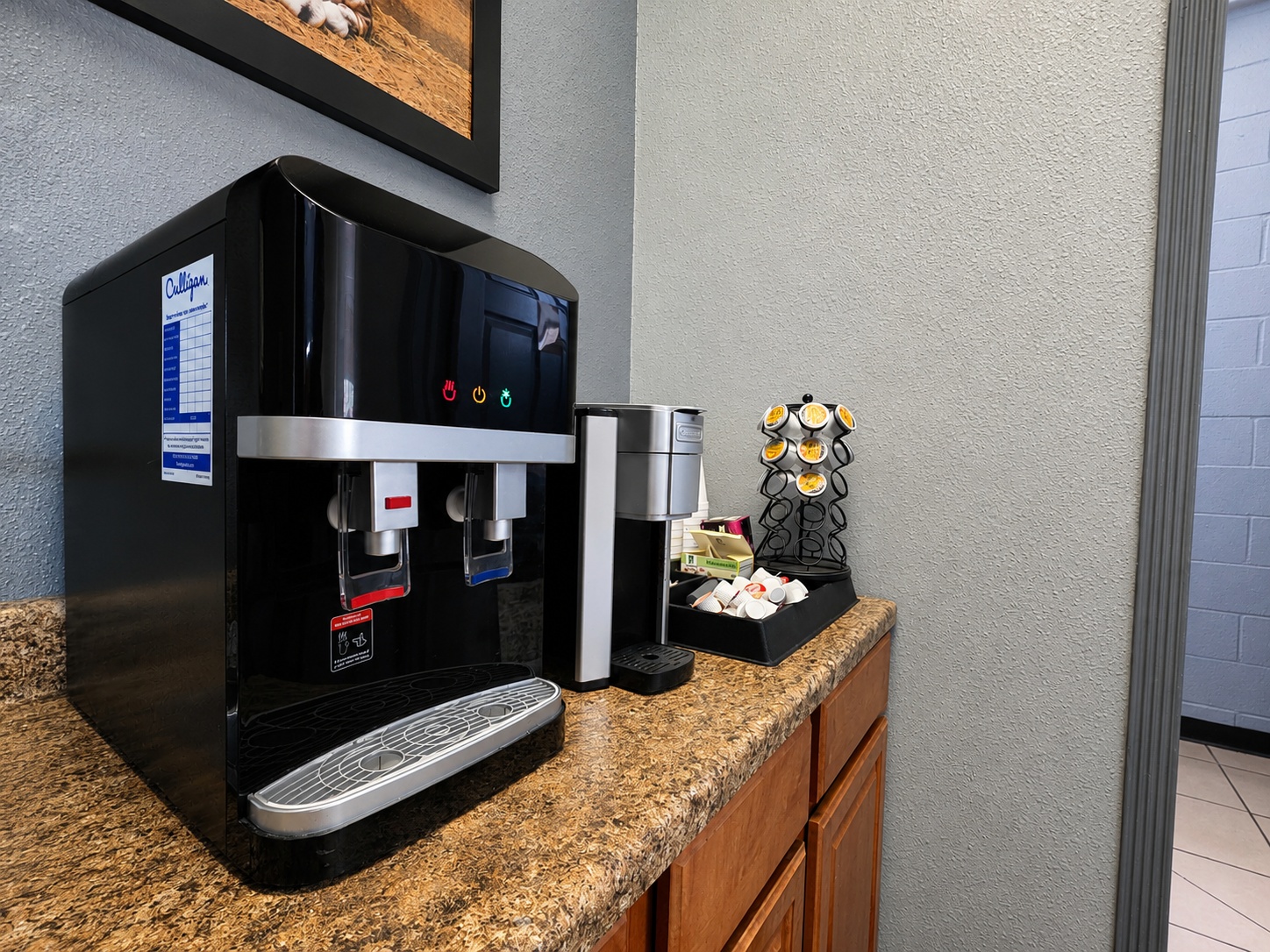 Complimentary coffee and water station at Auto Care USA in Spring, TX